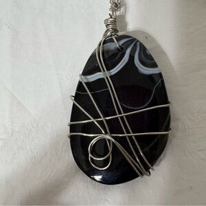 Handmade black agate wire-wrapped pendant.